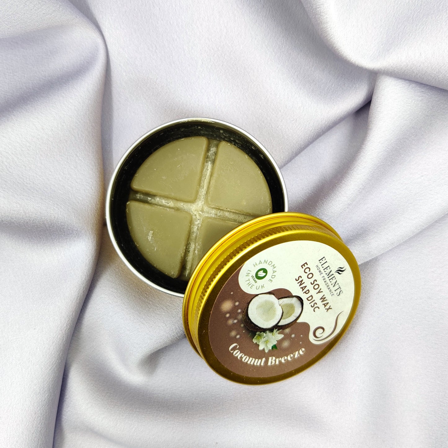 Kookos tuoksuvahapurkki violetilla taustalla